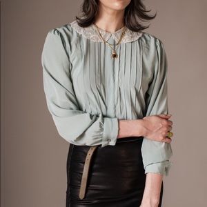 Icy seafoam green polyester blouse with net lace Peter Pan collar.